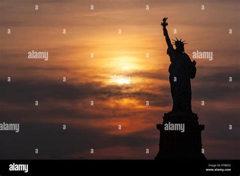 silhouette statue of liberty at sunset in New York, USA Stock Photo - Alamy