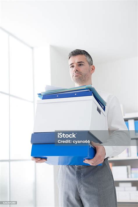 Confident Businessman Carrying Boxes Stock Photo Download Image Now