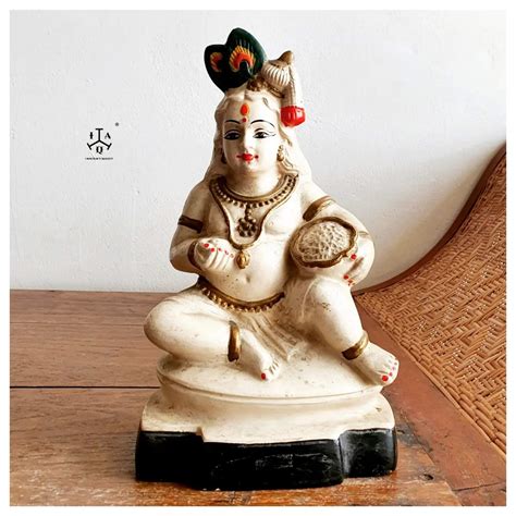 Lord Krishna as butter thief eating butter from his pot - Indian Antique Quest