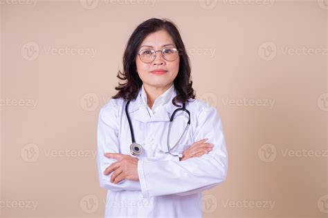 Image of middle aged Asian female doctor on background 7587011 Stock ...