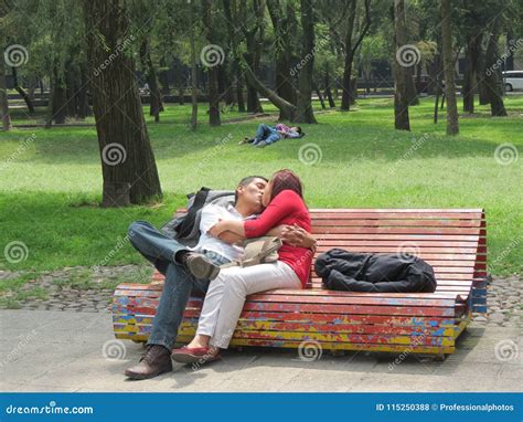 Couple Kissing On A Colorful Park Bench Editorial Stock Photo Image