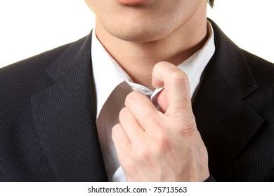 Handsome Businessman Loosening Tie Photos And Images Shutterstock