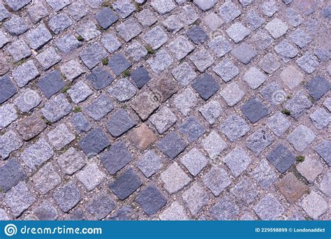 Old Cobblestone Pavement Close Up Background And Texture Stock Image