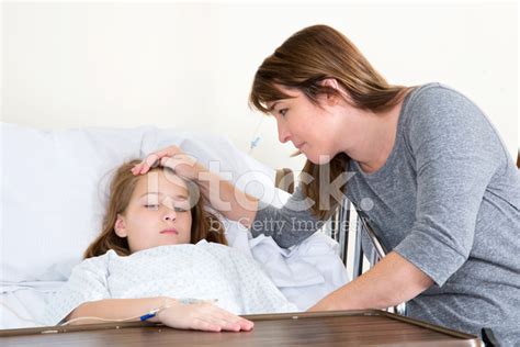 Mother Shows Concern for Her Sick Child IN The Hospital Stock Photos ...