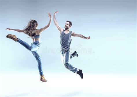 Two Young Dancers in a Jumping Pose Stock Photo - Image of beauty ...