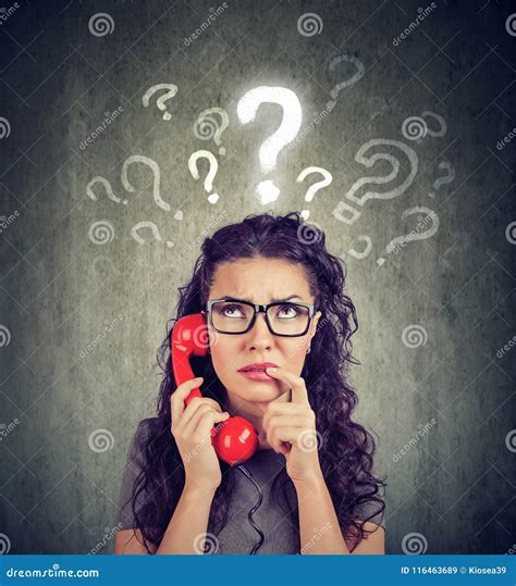 Upset Worried Confused Woman Talking On A Phone Has Many Questions