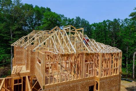 Wooden Roof Framework On Stick Built Home Under Construction Of Attic