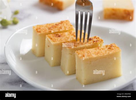 Traditional Chinese Baked Sweet Cassava Cake Served In Slices On White