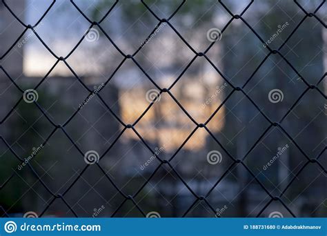 Metall Wire Fence With Unfocused City Backgorund Stock Photo Image Of