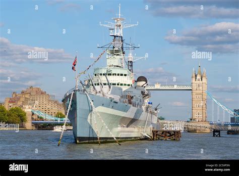 The Hms Belfast Warship Docked Near Tower Bridge On The River Thames In