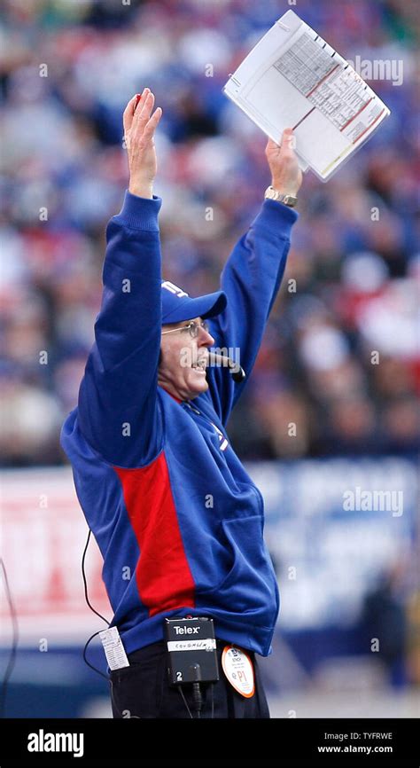 New York Giants Head Coach Tom Coughlin Raises His Hands In The Air On