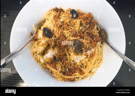 Spaghetti With Tuna And Tomatoes And Olives And Pecorino Cheese Stock