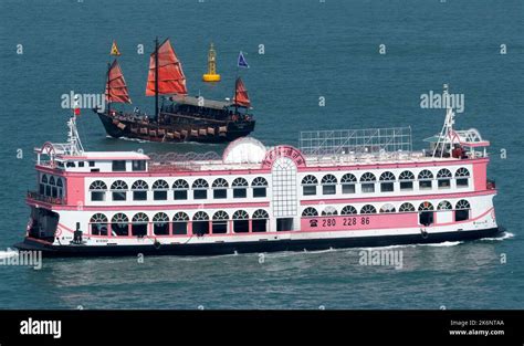 Traditional Chinese Junk And Tourist Ferry Victoria Harbor Hong Kong