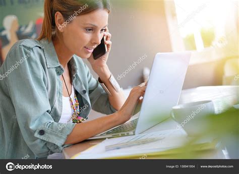 Woman working from home Stock Photo by ©Goodluz 158941954