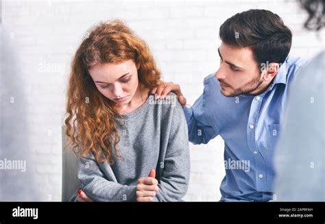 Caring Husband Comforting His Depressed Wife On Meeting With Marriage