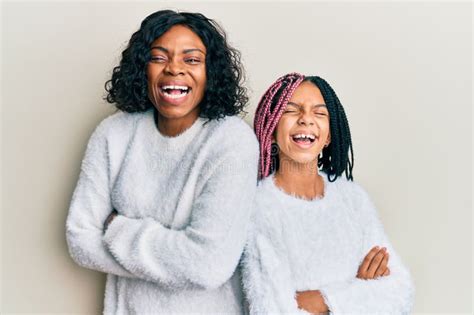 Beautiful African American Mother And Daughter With Arms Crossed Gesture Smiling And Laughing