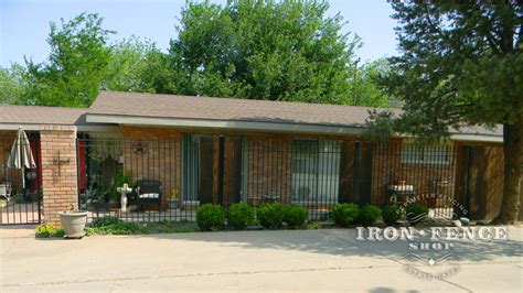 6ft Tall Traditional Grade Iron Fence Used In Conjunction With Brick