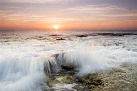 Close Up Shot Of A Foamy Ocean Wave During The Golden Hour Stock Image