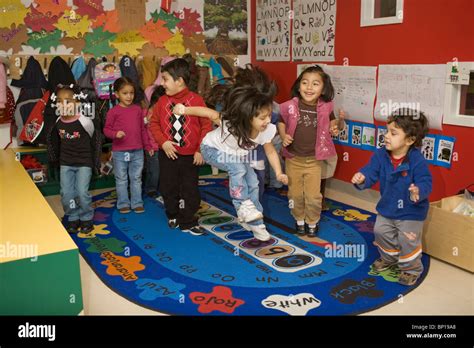 Preschool children dancing in the classroom Stock Photo - Alamy