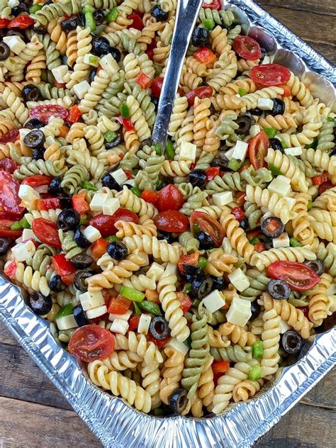 Tri Colored Rotini Pasta Salad With Cherry Tomatoes Olives Cheese