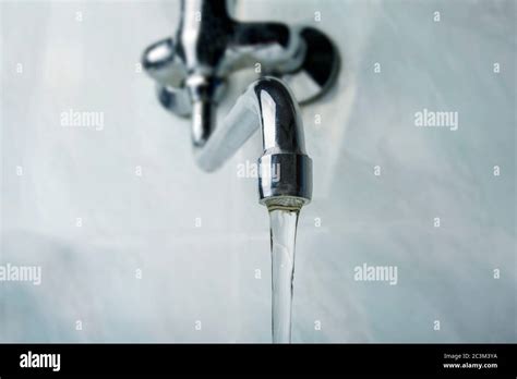 Running Water Faucet In The Bathroom Stock Photo Alamy