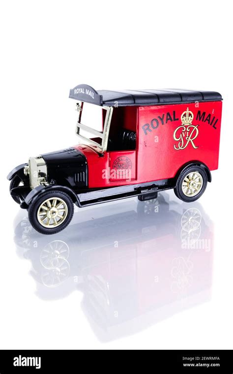 Worn diecast model of a Royal Mail van. Isolated on a white background ...