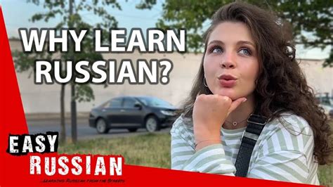 A Woman Is Standing In Front Of A Building With The Words Why Learn