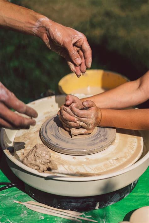 Potter Making A Clay Object On Pottery Wheel In Outdoors Craftsman