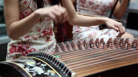 Chinese Traditional Musician Playing Chinese Guzheng.Guzheng, Also ...