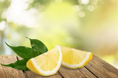 Premium Photo | Fresh lemon slices on wooden background