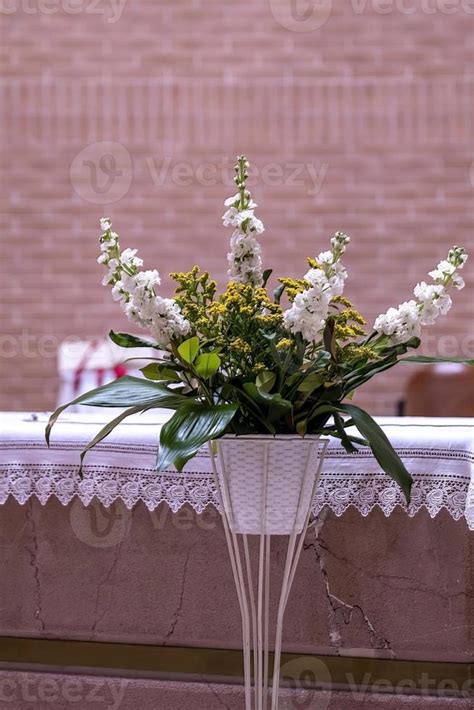 plant flowers in church decorations for baptism 7992059 Stock Photo at Vecteezy