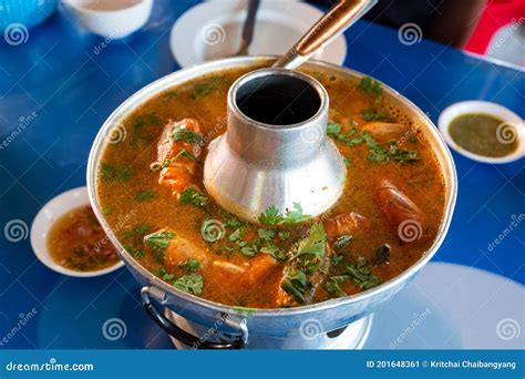 Tom Yum Kung Or Prawn Spicy Soup Put On Thai Style Hot Pot At Street Food Market Stock Image