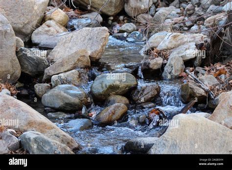 Small Ravine Flowing Through An Area With Big Stones Stock Photo Alamy