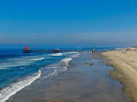 Aerial View Of Huntington Beach With The Pier On The Background