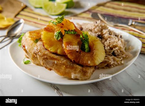 Marinated Cuban Pineapple Pork Chops With Traditional Black Bean Rice