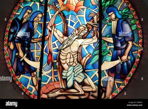 Stain glass window in Catholic Church of Jesus being sacrificed on the ...