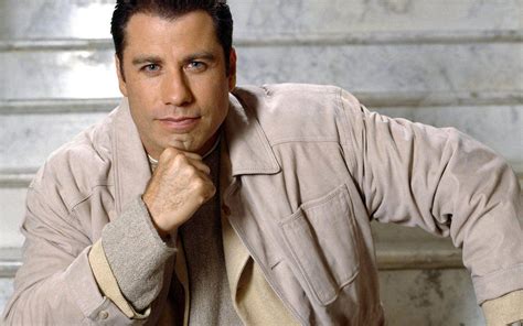 Download Caption John Travolta Iconic American Actor In Creative Pose