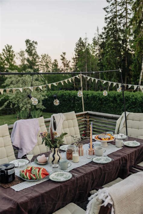 exquisite outdoor dining setup   tempting array  food  drinks