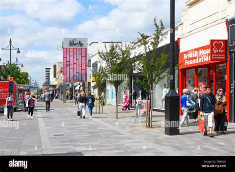Pedestrianised Romford town centre shopping street including sign for