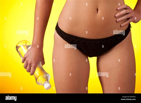 Part Of Female Body Wearing Black Bikini And Holding Bottle Of Water Stock Photo Alamy