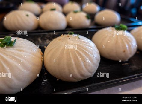 Close Up View Of Xiao Long Bao In A Steamer Basket Inside A Restaurant