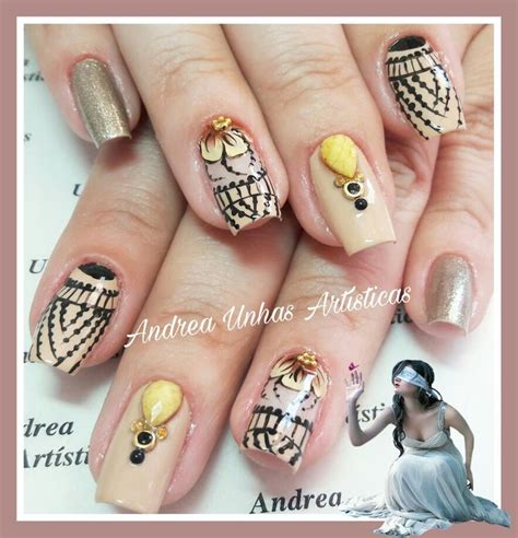 A Woman With Some Fancy Nail Art On Her Nails