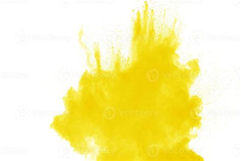 Yellow dust particles explosion on white background. Yellow powder dust ...