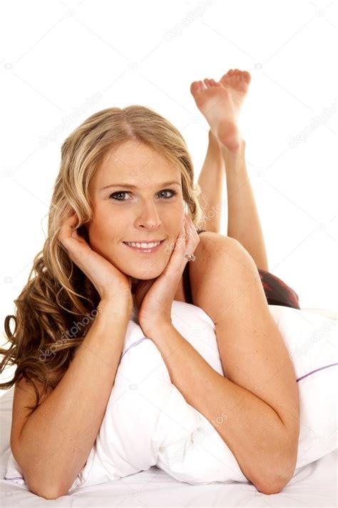 Woman Bed White Pillow Lay Feet Up — Stock Photo © Alanpoulson 42368975