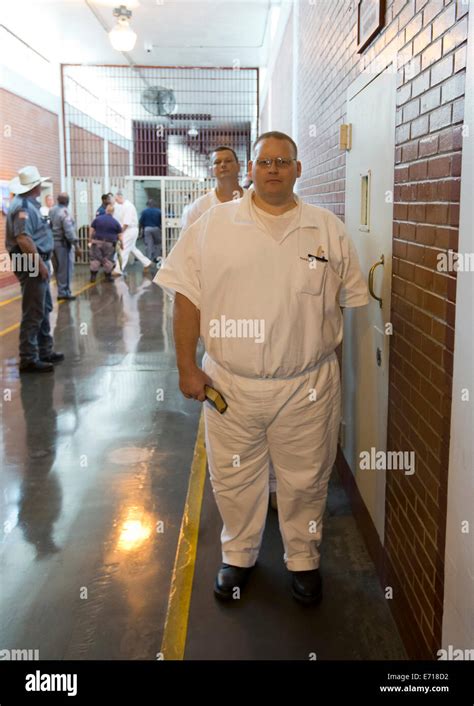 Male inmates line-up in hallways of Darrington Correctional Institute. The prison is near ...