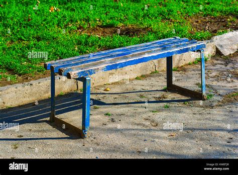 Old painted wooden bench in the park Stock Photo - Alamy