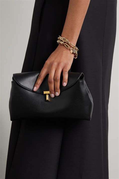 Toteme T Lock Leather Clutch Editorialist