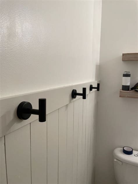 Towel Hooks On Shiplap Wainscoting In Apartment Inspiration