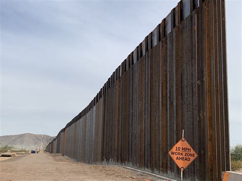 Protesters bang on new border wall despite Border Patrol orders to stay ...