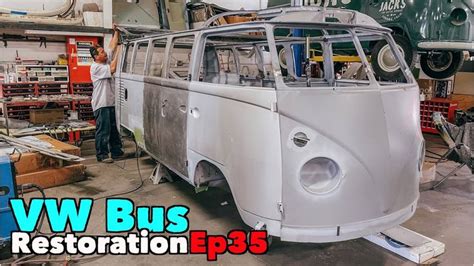 an old vw bus is being worked on in a garage with the words vw bus ...